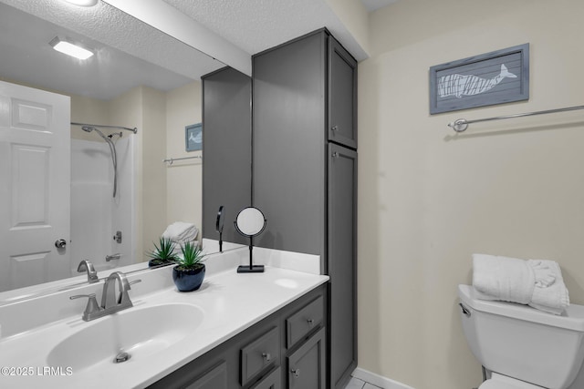 full bathroom featuring vanity, toilet, shower / bathing tub combination, and a textured ceiling