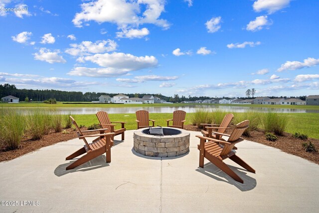 1493 Sanctum St, Ridgeland, SC 29936 - view of patio with an outdoor fire pit and a water view