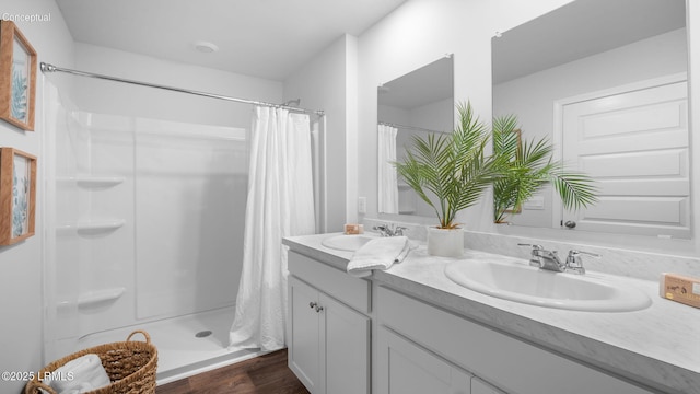 1493 Sanctum St, Ridgeland, SC 29936 - full bath with a shower stall, double vanity, and wood finished floors
