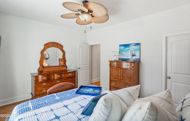 bedroom with hardwood / wood-style floors and ceiling fan