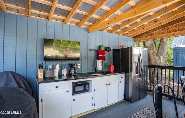 view of patio with sink and a wooden deck