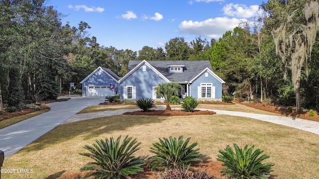 view of front of home featuring a garage and a front lawn