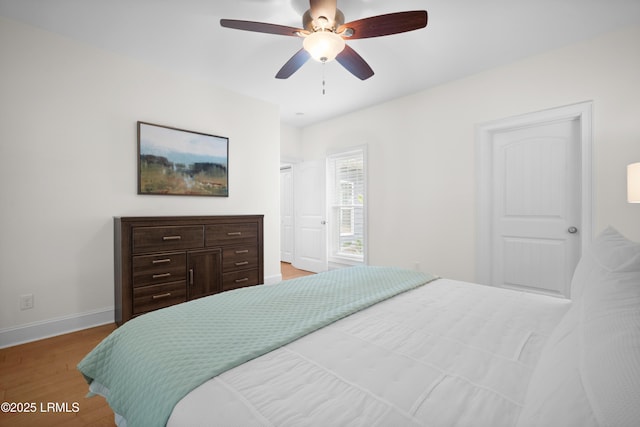 bedroom featuring ceiling fan and hardwood / wood-style floors