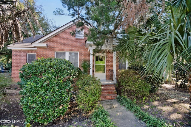 view of front of property featuring brick siding