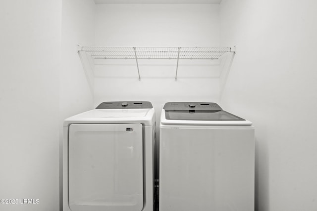 clothes washing area with laundry area and washing machine and dryer