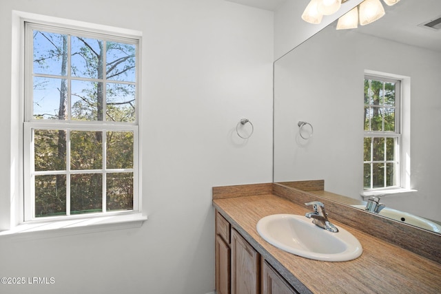 bathroom with vanity and visible vents