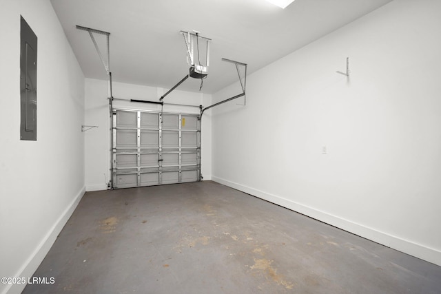 garage with electric panel, baseboards, and a garage door opener