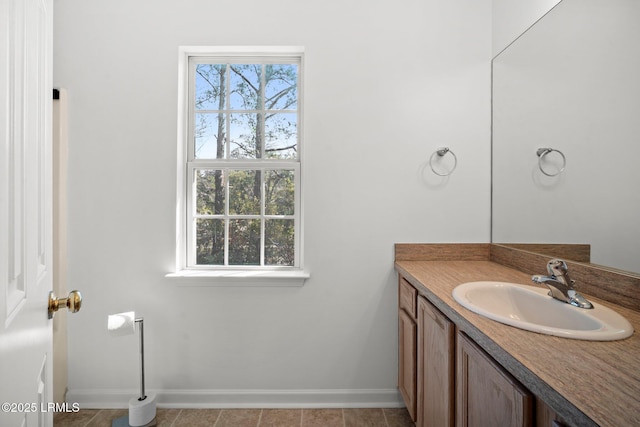 bathroom with vanity and baseboards