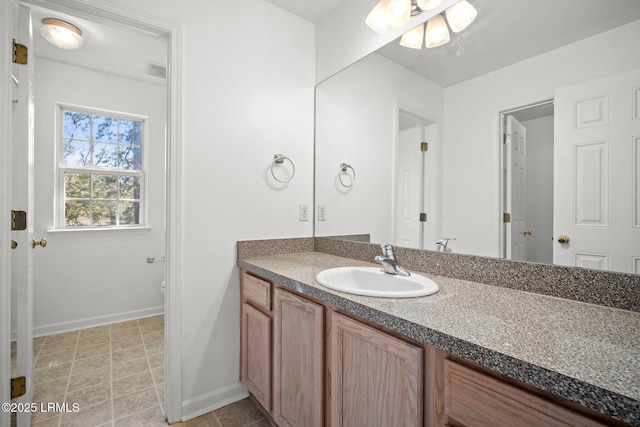 bathroom featuring visible vents, toilet, tile patterned flooring, baseboards, and vanity