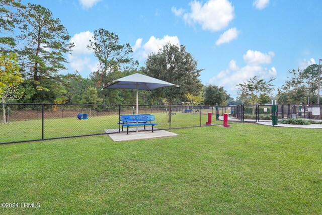 view of property's community with a lawn