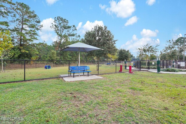 view of property's community with a lawn