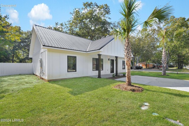 modern farmhouse with a front yard