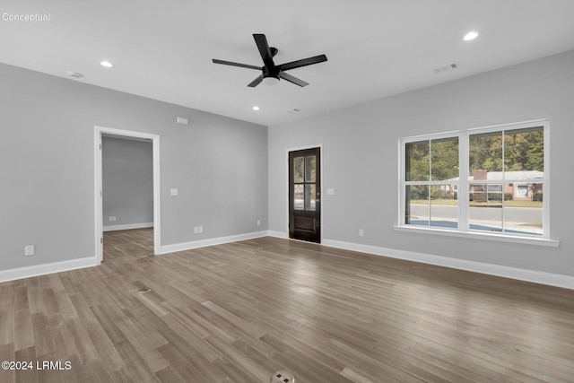 unfurnished living room with light hardwood / wood-style floors and ceiling fan