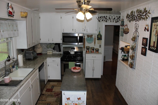 110 Joey St, Hampton, SC 29924 - kitchen with appliances with stainless steel finishes, ceiling fan, white cabinetry, a sink, and dark wood-style flooring