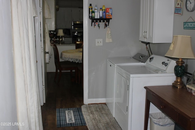 110 Joey St, Hampton, SC 29924 - clothes washing area with cabinet space, washer and dryer, wood finished floors, and baseboards