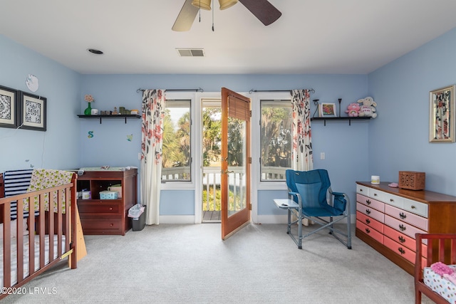 bedroom featuring light carpet and ceiling fan