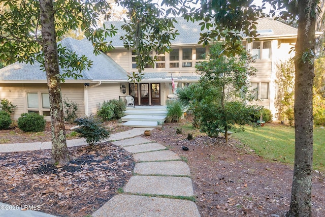 view of front of home featuring a sunroom