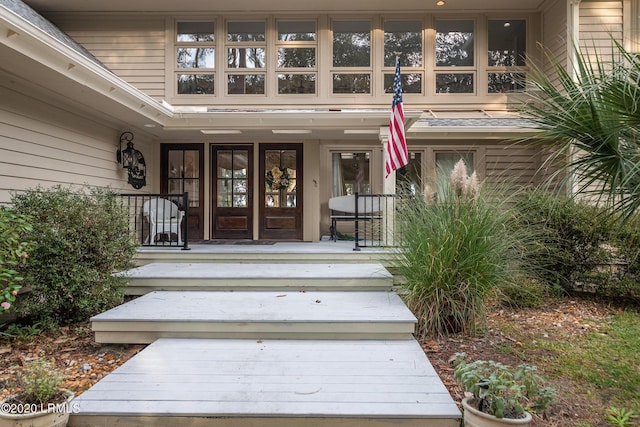 property entrance with covered porch