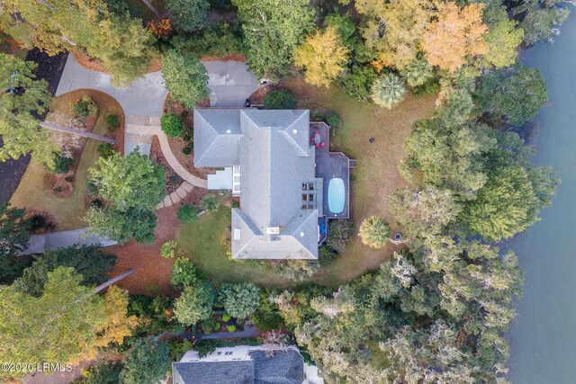 birds eye view of property with a water view