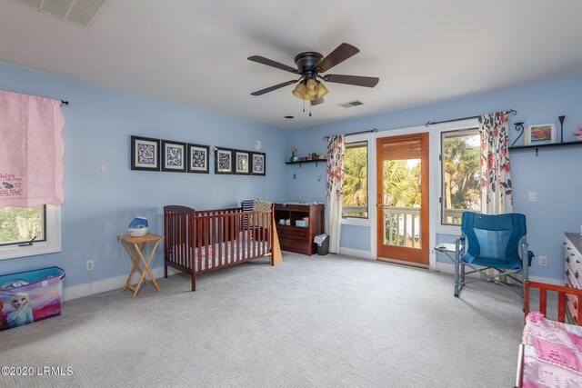 carpeted bedroom featuring ceiling fan