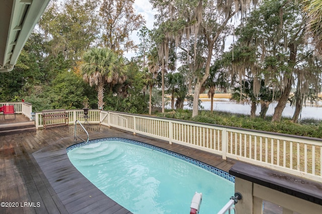 view of pool with a deck with water view