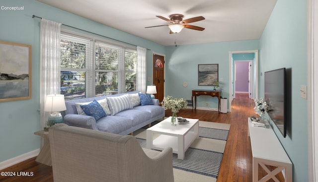 living room featuring dark hardwood / wood-style floors and ceiling fan