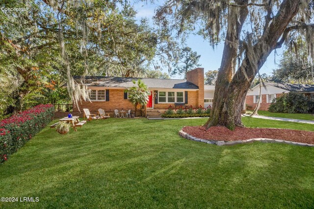 ranch-style house with a front lawn