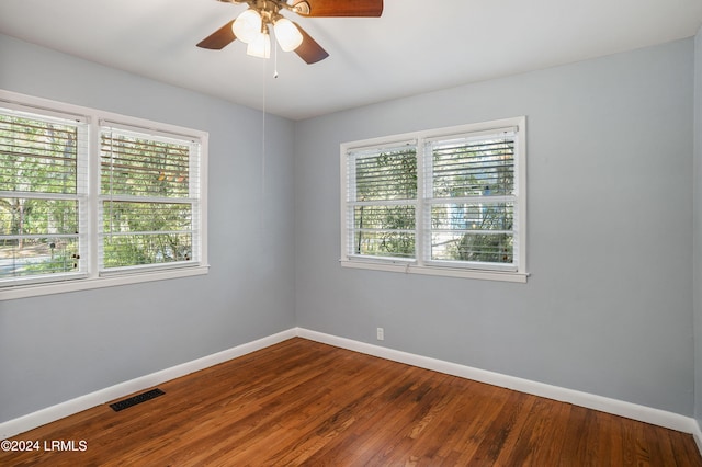 unfurnished room with hardwood / wood-style floors and ceiling fan