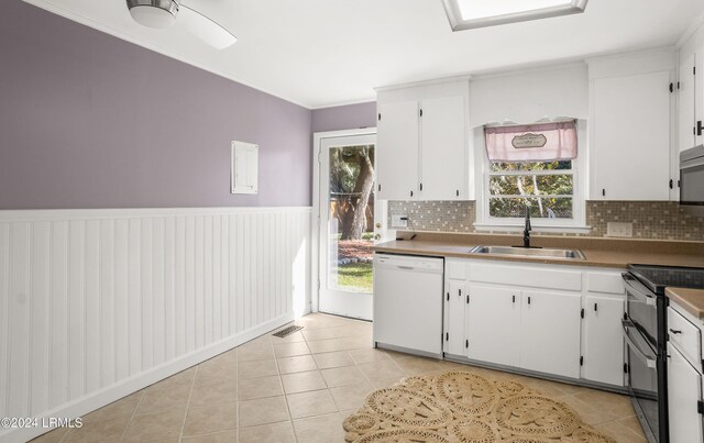 kitchen featuring sink, white cabinets, dishwasher, and range with two ovens