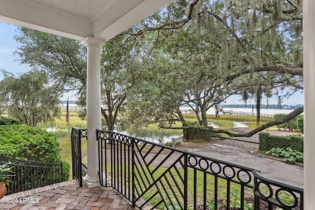 balcony featuring a water view