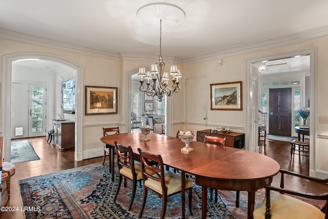 dining area featuring crown molding and dark hardwood / wood-style floors