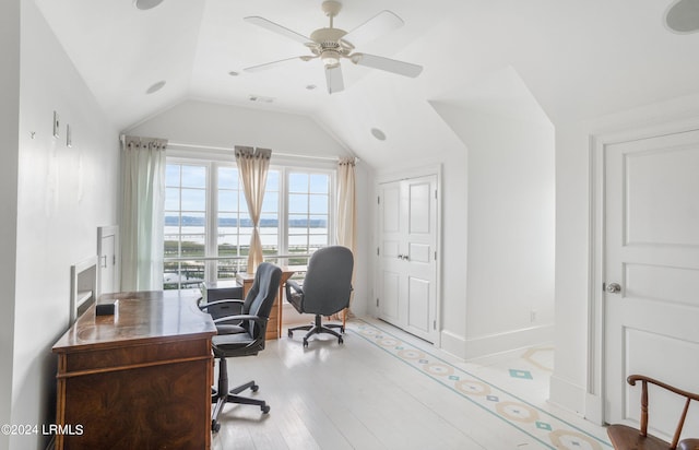 office featuring vaulted ceiling, ceiling fan, and light wood-type flooring