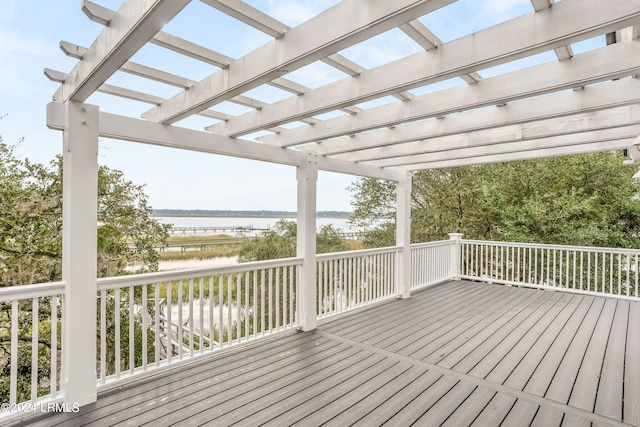 wooden terrace featuring a pergola and a water view