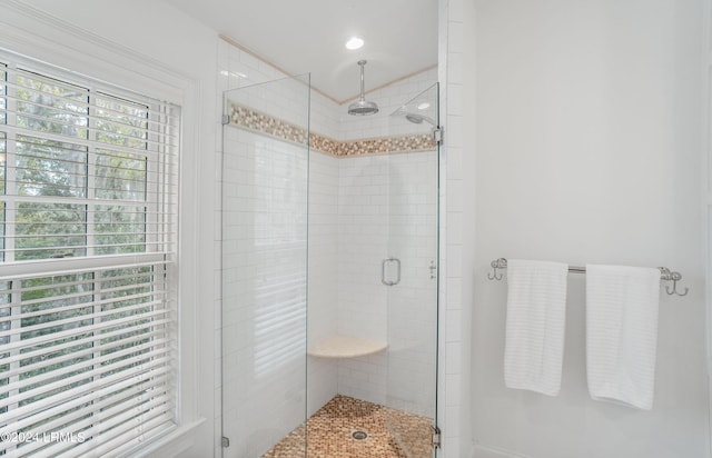 bathroom with a wealth of natural light and an enclosed shower