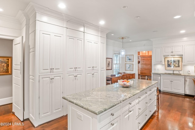 kitchen with dark wood-type flooring, dishwasher, a kitchen island, pendant lighting, and white cabinets