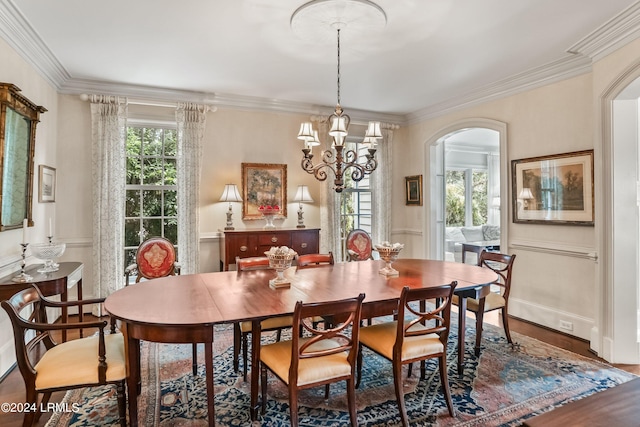 dining room with crown molding and wood-type flooring