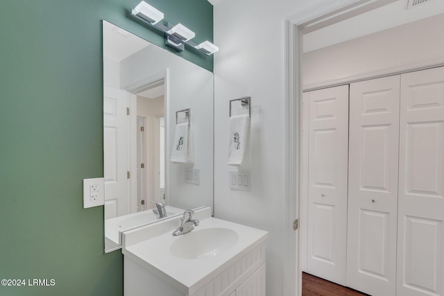 bathroom featuring vanity and hardwood / wood-style floors