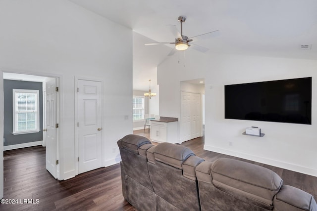 living room featuring ceiling fan with notable chandelier, plenty of natural light, high vaulted ceiling, and dark hardwood / wood-style floors