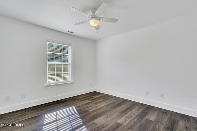 unfurnished room with ceiling fan and dark hardwood / wood-style floors