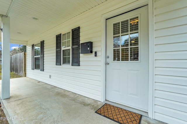 doorway to property featuring a porch