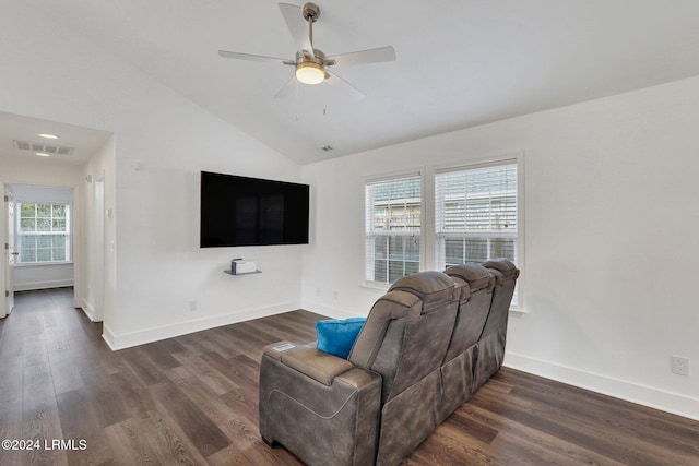 living room featuring lofted ceiling, plenty of natural light, and dark hardwood / wood-style flooring