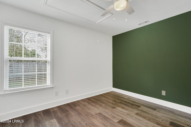 spare room with wood-type flooring and ceiling fan