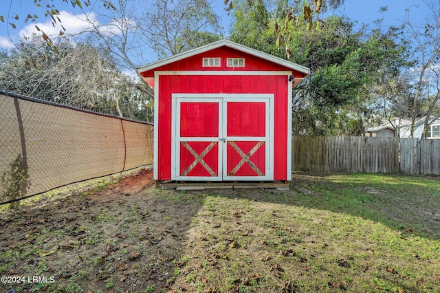 view of outbuilding with a lawn