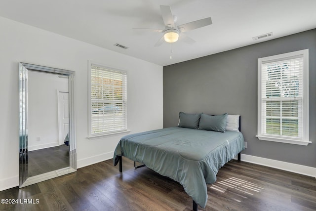 bedroom featuring dark hardwood / wood-style flooring and ceiling fan