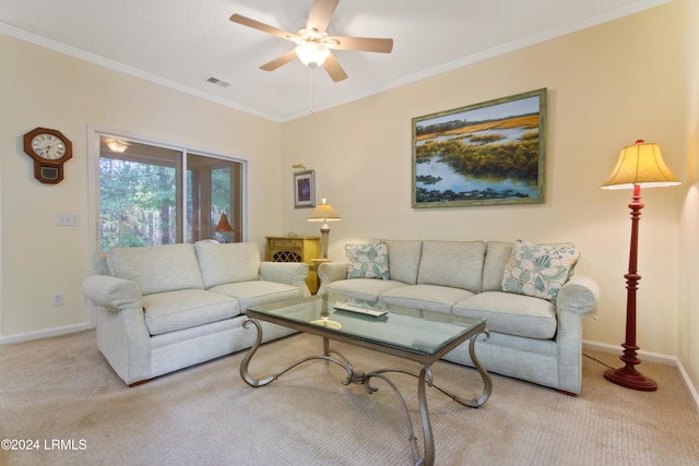 living area with baseboards, ceiling fan, visible vents, crown molding, and light carpet