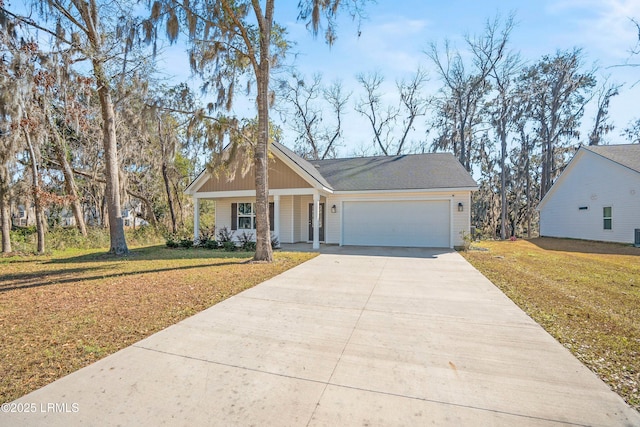 view of front of home featuring a garage, a porch, and a front yard