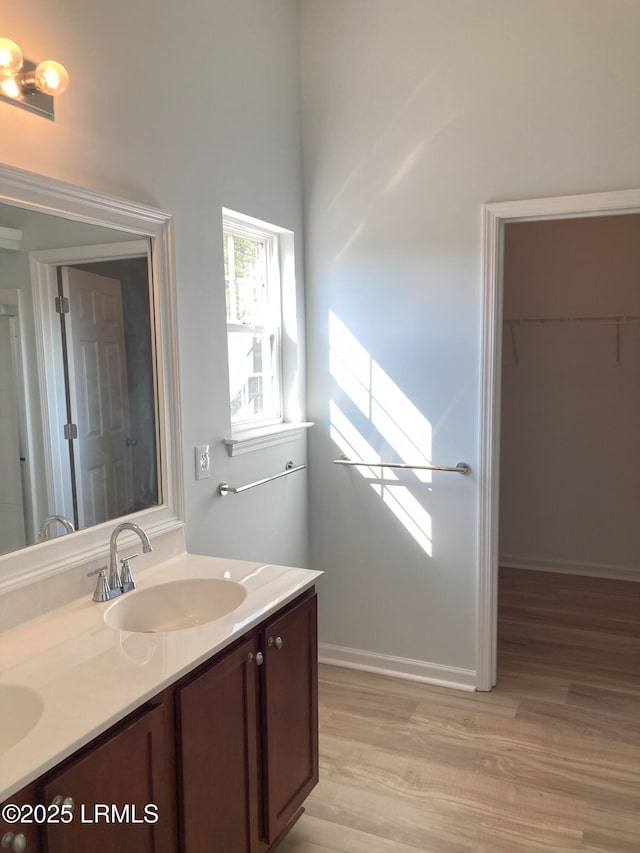 bathroom featuring vanity and wood-type flooring