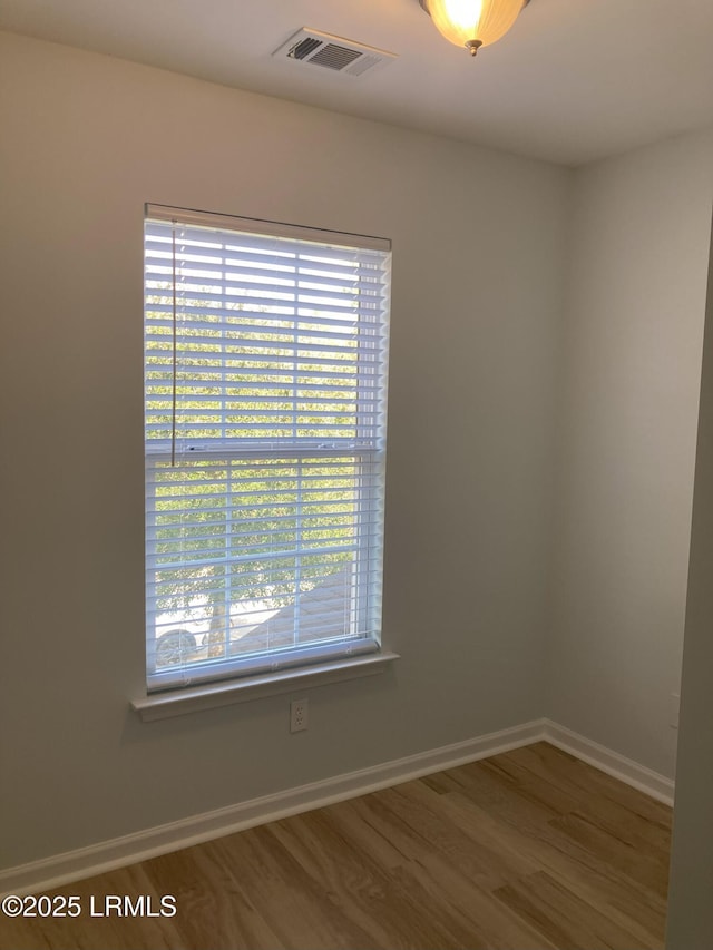 empty room with wood-type flooring