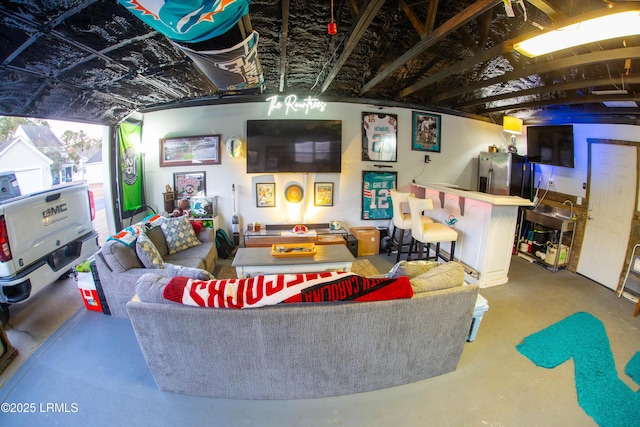 living room with concrete flooring