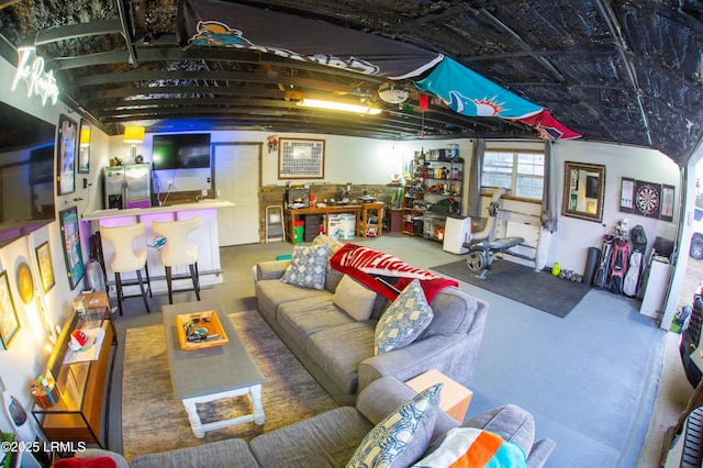 living room featuring concrete flooring